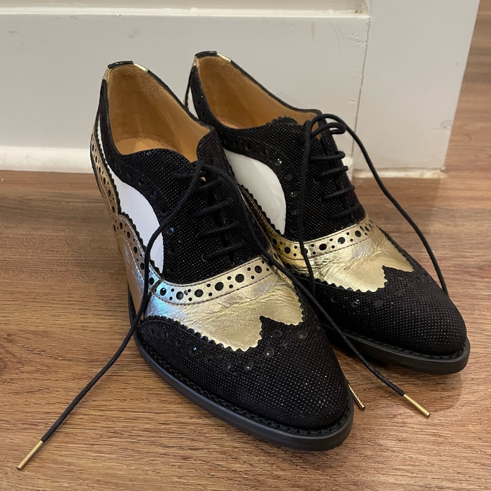 The office of Angela Scott Mr. Gold Leather Heeled Oxfords